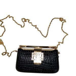 Black‎ and gold clutch